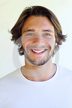 Handsome young smiling man with beard