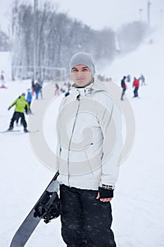 Handsome young snowboarder