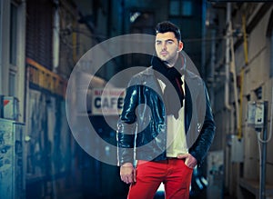 Handsome young stylish guy .Vogue style photo of a handsome man on the street.Young attractive man in urban background