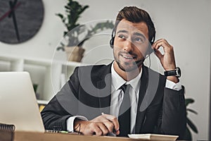 handsome young technical support worker making call