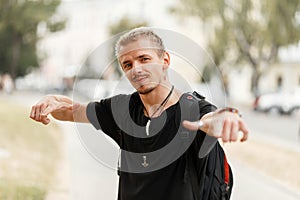 Handsome young tourist man in a black T-shirt