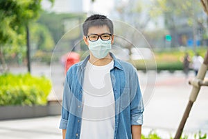 HandsomeMan wearing face mask protect filter against air pollution PM2.5 or wear N95 mask. protect pollution, anti smog and