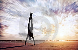 Handstand near the ocean photo