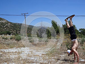 Handstanding in Dirt grass Field in California