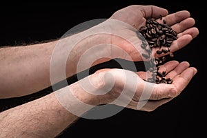 Handswith coffee isolated on black background photo