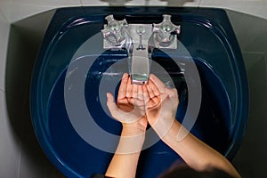 Handwash with plenty of soap and water to prevent the spread of covid 19