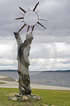 Handwork of wooden pagan idol with The Sun