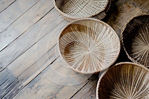 handwoven baskets on a distressed wood floor