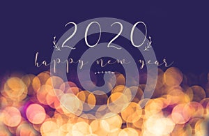 Handwriting 2020 happy new year on vintage blur festive bokeh light background,holiday greeting card