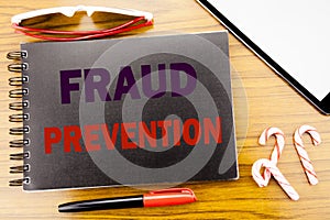 Handwriting Announcement text Fraud Prevention. Business concept for Crime Protection Written on notepad notebook book with wood
