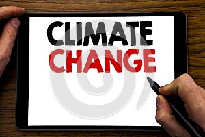 Handwriting Announcement text showing Climate Change. Business concept for Global Planet Warming Written on tablet laptop, wooden