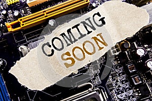 Handwriting Announcement text showing Coming Soon. Business concept for Message Future Written on sticky note, computer main board