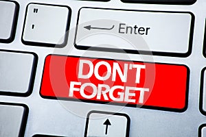 Handwriting Announcement text showing Do Not Forget. Business concept for Don t memory Remider written on red key on the keybord b photo