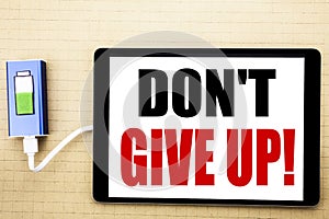 Handwriting Announcement text showing Don t Give Up. Business concept for Motivation Determination, Written on tablet with white b