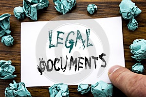 Handwriting Announcement text showing Legal Documents. Business concept for Contract Document Written on sticky note paper, wooden