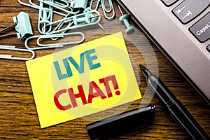 Handwriting Announcement text showing Live Chat . Business concept for Communication Livechat written on sticky note paper on the photo