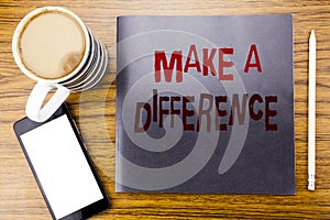 Handwriting Announcement text showing Make A Difference. Business concept for Motivation Success Written on notepad note paper, wo