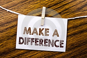 Handwriting Announcement text showing Make A Difference. Business concept for Motivation Success written on sticky note paper on t