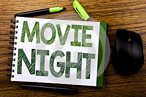 Handwriting Announcement text showing Movie Night. Business concept for Wathing Movies written on notebook book note paper on the
