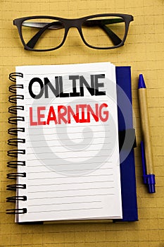 Handwriting Announcement text showing Online Learning. Business concept for E-learning Training Written on tablet laptop, wooden b