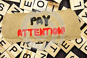 Handwriting Announcement text showing Pay Attention. Concept meaning Be Careful Beware Mindful Alarm written on tear paper note on