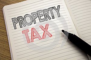 Handwriting Announcement text showing Property Tax. Business concept for Estate Income Taxation written on notebook with copy spac