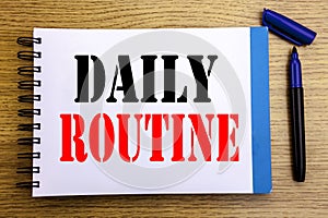 Handwriting Announcement text showing Daily Routine. Business concept for Habitual Lifestyle Written on notepad note paper backgro