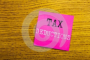 Handwriting Announcement text showing Tax Deductions. Business concept for Finance Incoming Tax Money Deduction written on sticky