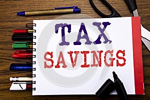 Handwriting Announcement text showing Tex Savings . Business concept for Tax Savings Extra Money Refund Written on notebook, woode