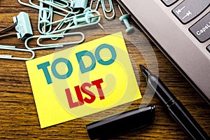 Handwriting Announcement text showing To Do List. Business concept for Plan Lists Remider written on sticky note paper on the wood photo