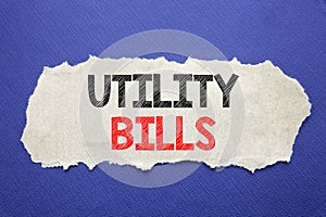 Handwriting Announcement text showing Utility Bills. Business concept for Money Bill Payment Written on note paper with black back