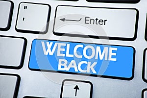 Handwriting Announcement text showing Welcome Back. Business concept for Emotion Greeting written on red key on the keybord backgr