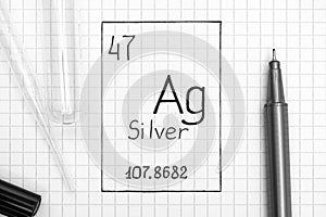 Handwriting chemical element Silver Ag with black pen, test tube