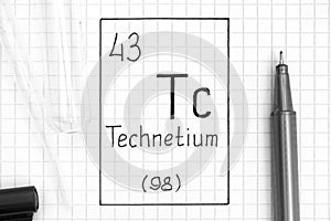 Handwriting chemical element Technetium Tc with black pen, test tube and pipette photo