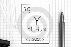Handwriting chemical element Yttrium Y with black pen, test tube and pipette
