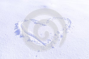 Handwriting heart shaped on snow