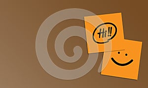 Handwriting of message Hi!! and smile face on orange sticky note on brown background with your copy space