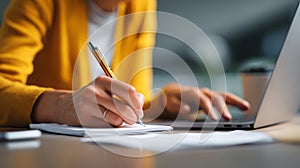 Handwriting notebook laptop office workspace woman writing notes while using computer