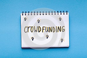 Handwriting red text in notepad on blue background