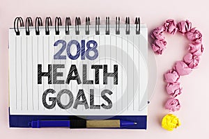 Handwriting text 2018 Health Golas. Concept meaning new year plan Workout healthy food Resolution goals written on Notebook Book o