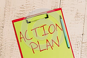 Handwriting text Action Plan. Concept meaning list of things or schedule to be made thia current year Colored clipboard