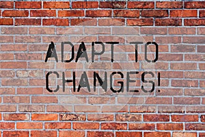 Handwriting text Adapt To Changes. Concept meaning Innovative changes adaption with technological evolution Brick Wall photo