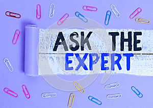 Handwriting text Ask The Expert. Concept meaning Looking for professional advice Request Help Support Paper clip and