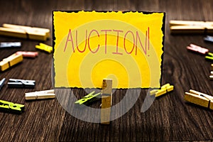 Handwriting text Auction. Concept meaning Public sale Goods or Property sold to highest bidder Purchase Clothespin