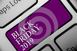 Handwriting text Black Friday 2019. Concept meaning day following Thanksgiving Discounts Shopping day Keyboard button hit key type