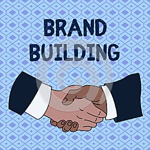 Handwriting text Brand Building. Concept meaning Generating awareness Establishing and promoting company Hand Shake