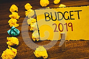 Handwriting text Budget 2019. Concept meaning New year estimate of incomes and expenses Financial PlanClothespin holding Yellow pa