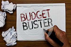 Handwriting text Budget Buster. Concept meaning Carefree Spending Bargains Unnecessary Purchases Overspending Man holding marker n