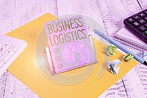 Handwriting text Business Logistics. Concept meaning concerned with materials procurement and management Notepaper stand on buffer