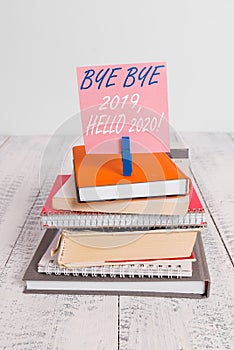 Handwriting text Bye Bye 2019 Hello 2020. Concept meaning saying goodbye to last year and welcoming another good one